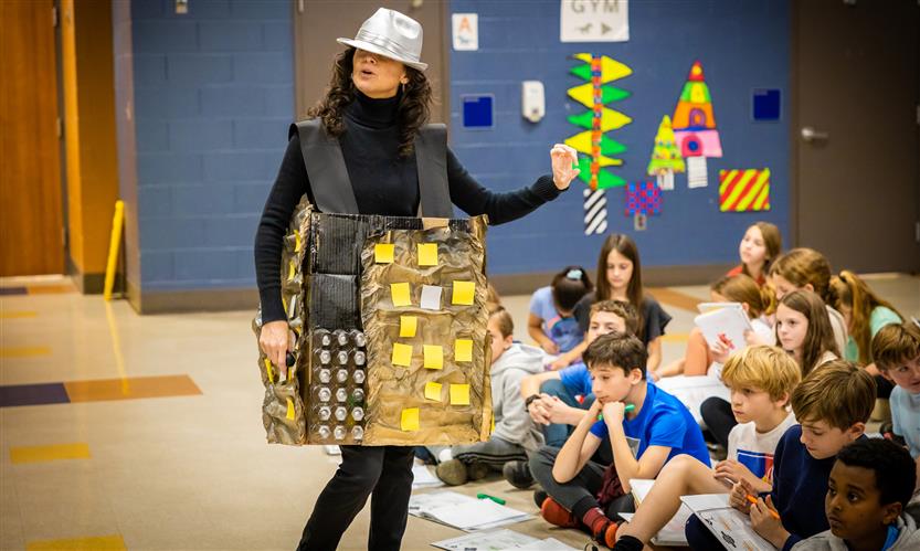 Teachers and students participate in a '20s catwalk presentation